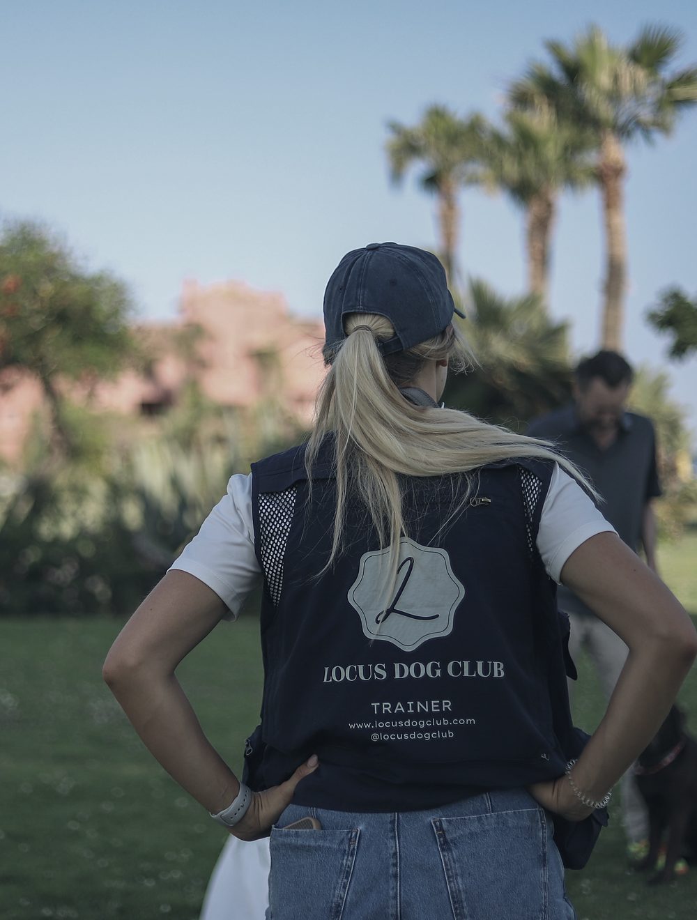 Alisa Groen in the Locus Dog Club trainer vest, watching a session